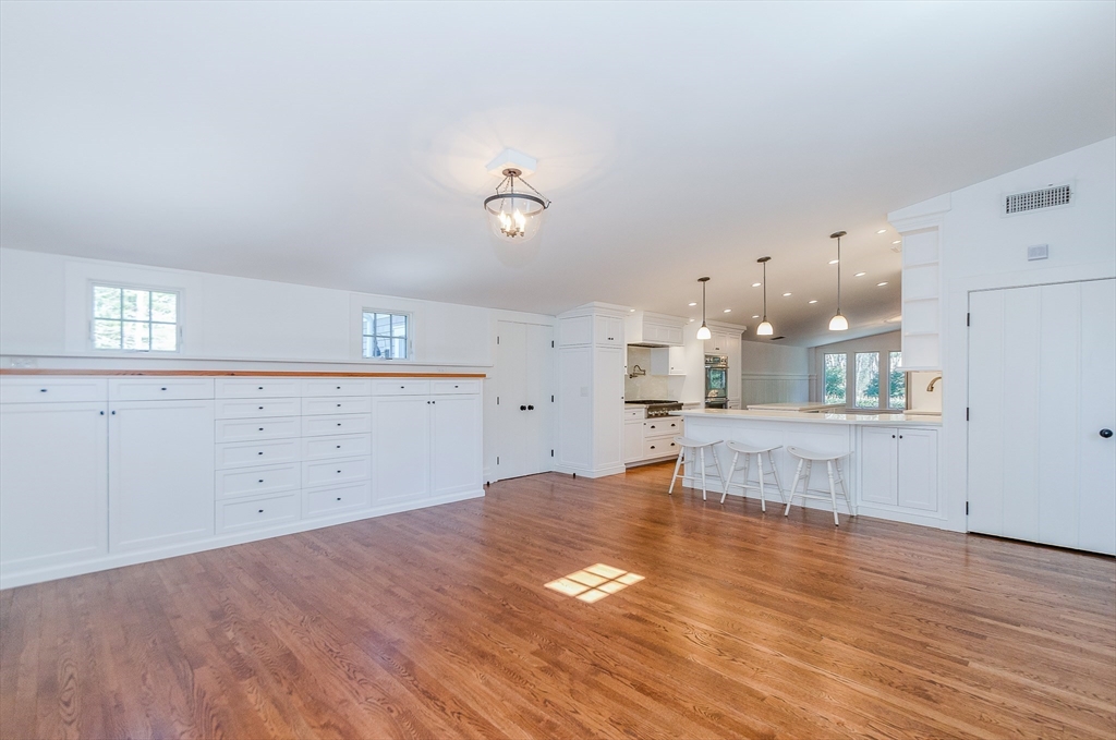 345 Point Road Marion, MA 02738 - Photo 8 of 41 a view of kitchen and hall with wooden floor
