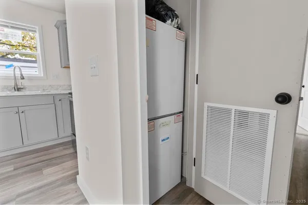 a view of bathroom with a sink and mirror