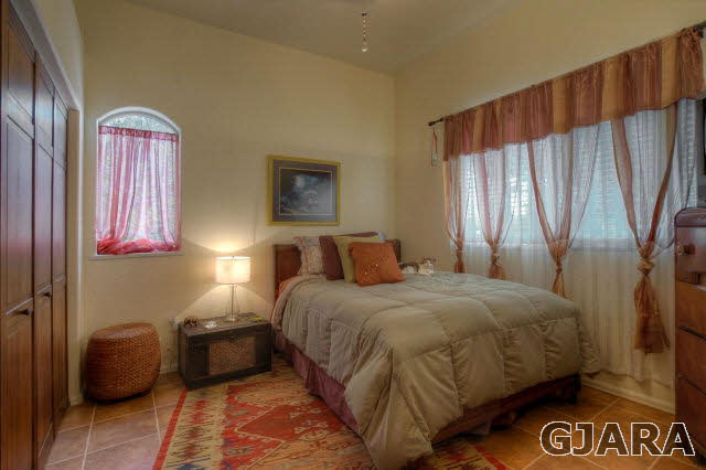 1701 10 Road Mack, CO 81525 - Photo 17 of 25 a bedroom with a bed and a view of bathroom