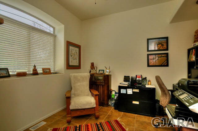 1701 10 Road Mack, CO 81525 - Photo 20 of 25 a room with furniture and wooden floor