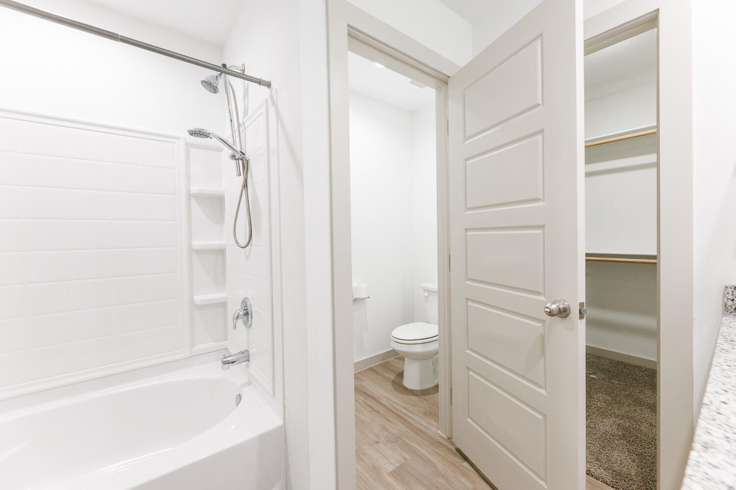 2305 150th Street Lubbock, TX 79423 - Photo 25 of 39 a bathroom with a toilet and a shower