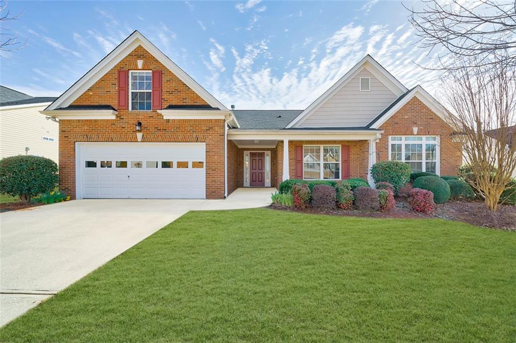 2573 Carleton Gold Road Dacula, GA 30019 - Photo 1 of 1 Brick front with covered front porch Grass edited green.