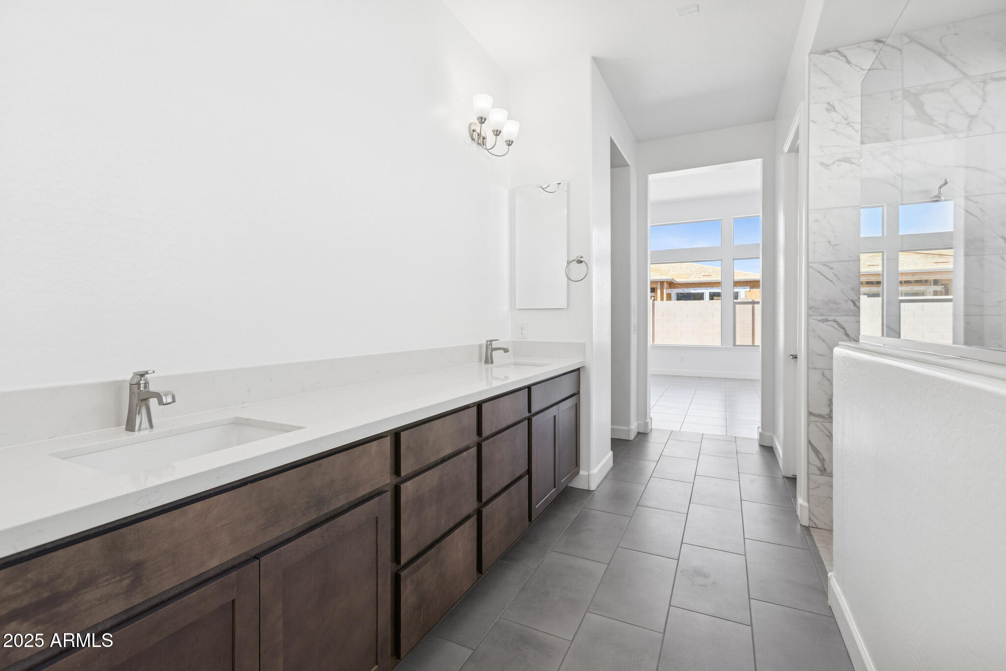1110 West J. Waltz Way Apache Junction, AZ 85120 - Photo 11 of 32 a spacious bathroom with a double vanity sink a mirror and a shower