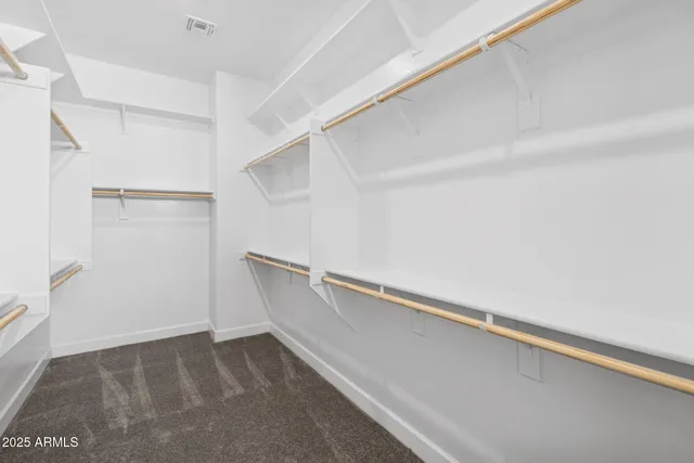 a view of an empty walk in closet