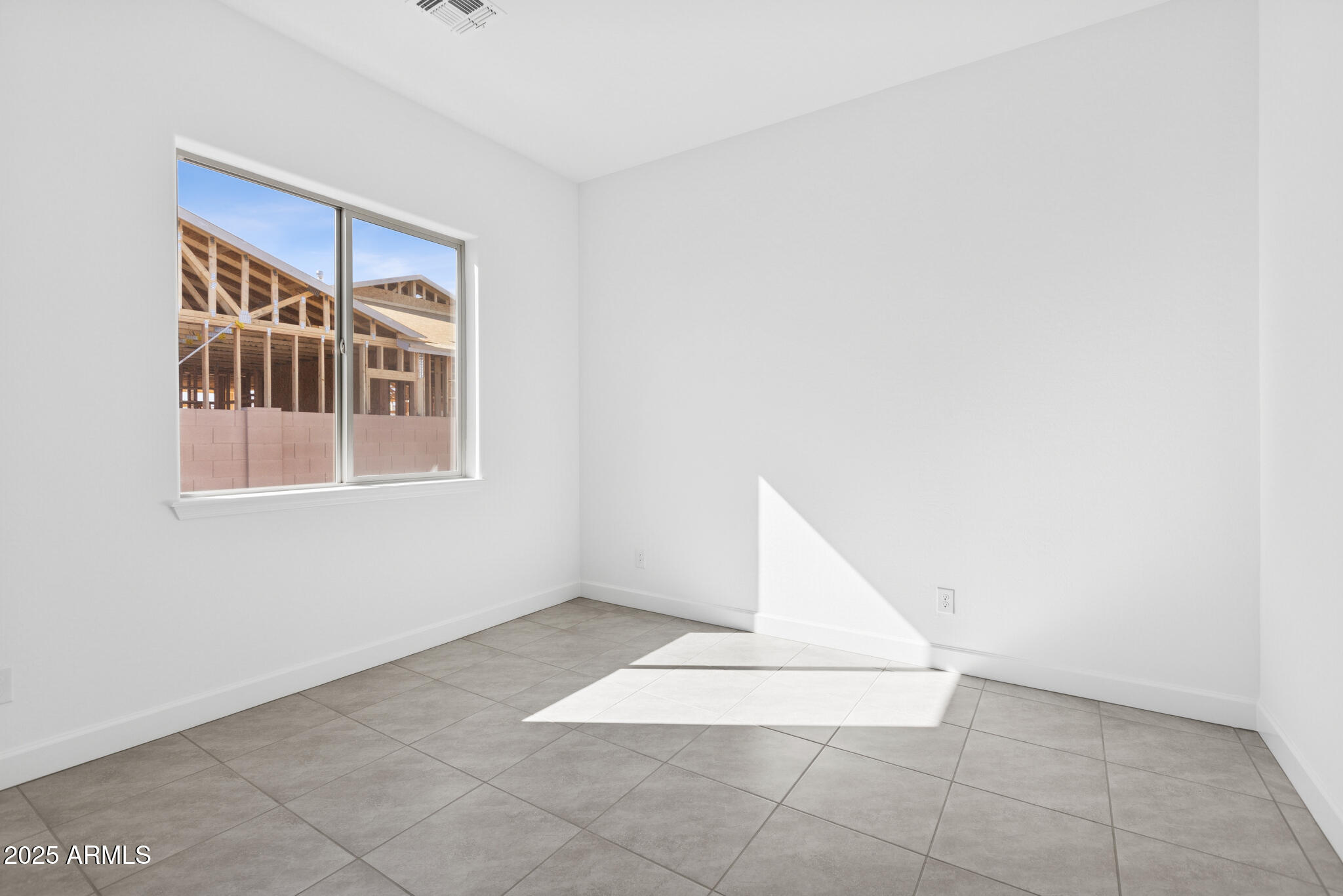 1110 West J. Waltz Way Apache Junction, AZ 85120 - Photo 18 of 32 a view of an empty room with a window