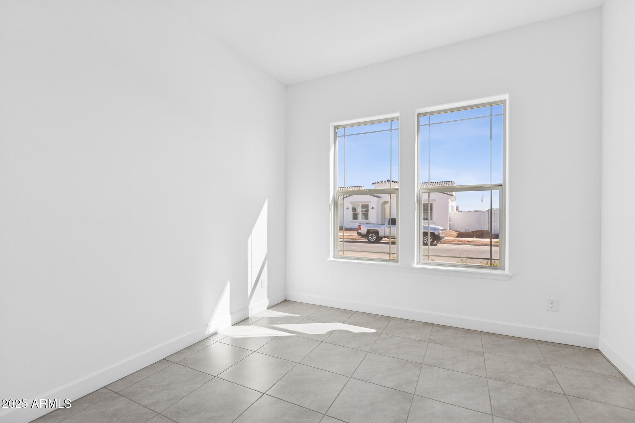 1110 West J. Waltz Way Apache Junction, AZ 85120 - Photo 19 of 32 a view of an empty room with closet and a window