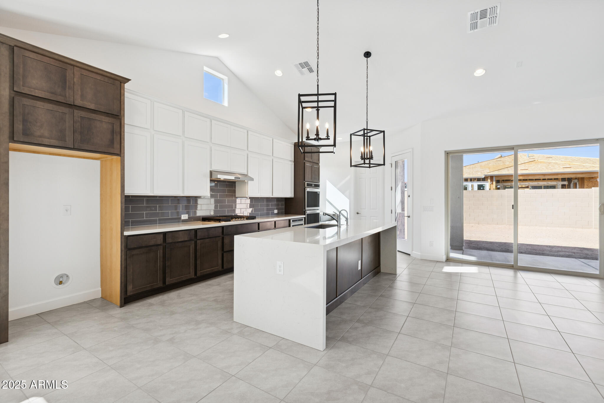 1110 West J. Waltz Way Apache Junction, AZ 85120 - Photo 2 of 32 a kitchen with a refrigerator a sink and cabinets