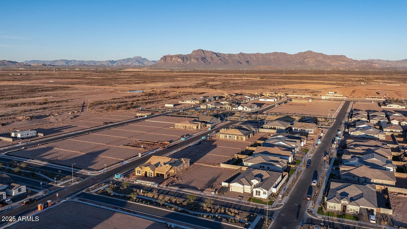 1110 West J. Waltz Way Apache Junction, AZ 85120 - Photo 30 of 32 an aerial view of residential houses with outdoor space