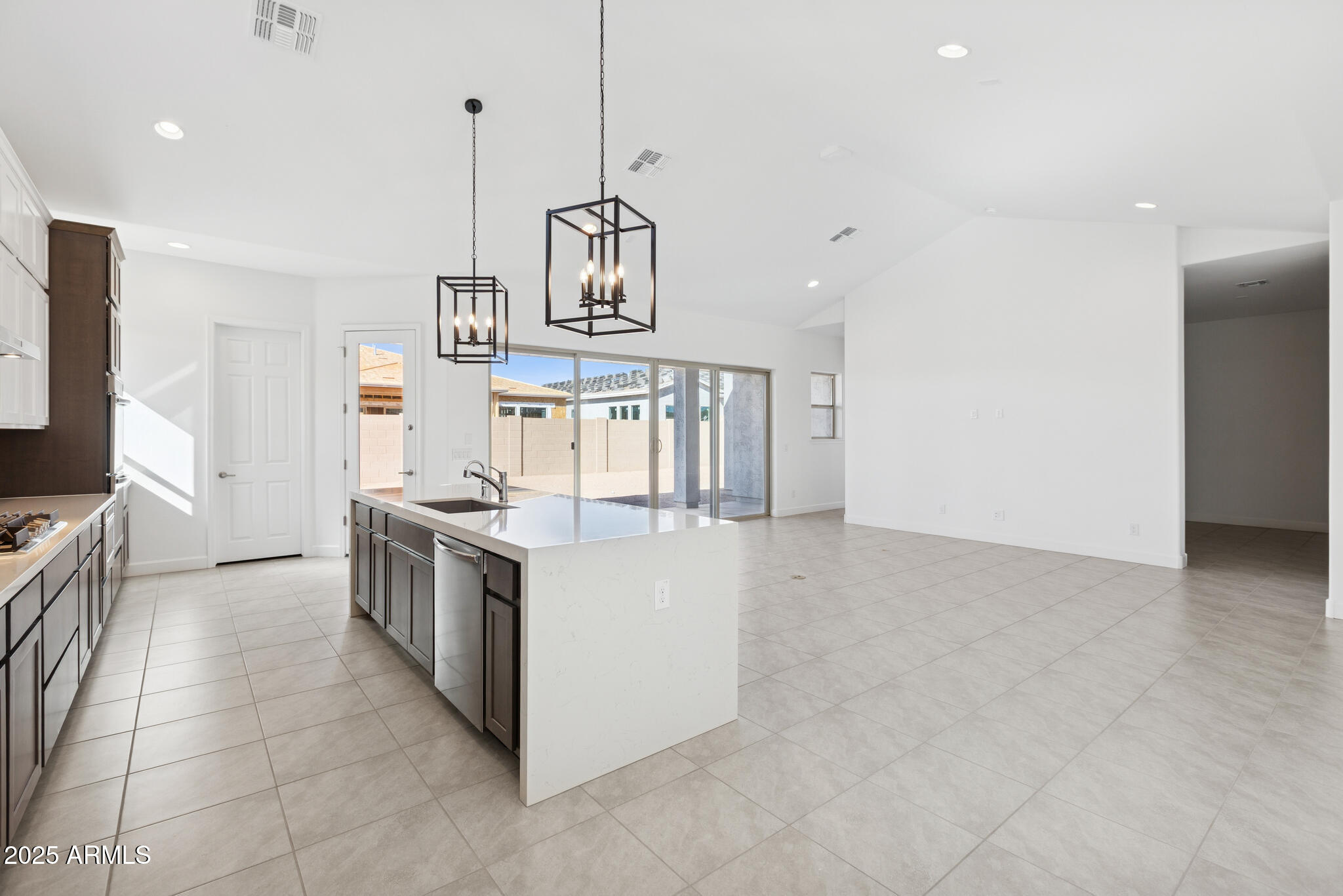 1110 West J. Waltz Way Apache Junction, AZ 85120 - Photo 5 of 32 a kitchen with stainless steel appliances granite countertop a stove a sink and a refrigerator