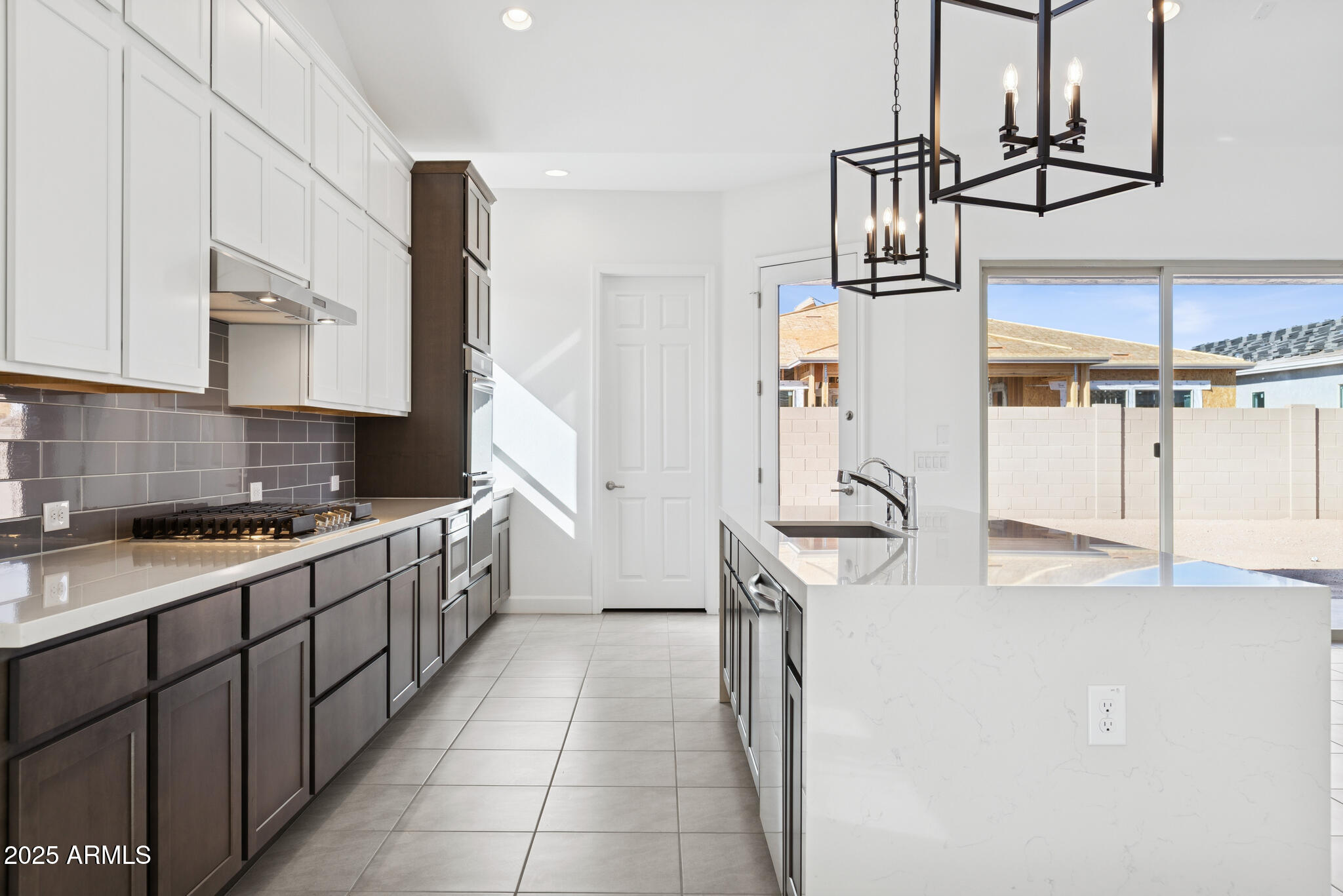 1110 West J. Waltz Way Apache Junction, AZ 85120 - Photo 7 of 32 a kitchen with a sink a stove and cabinets