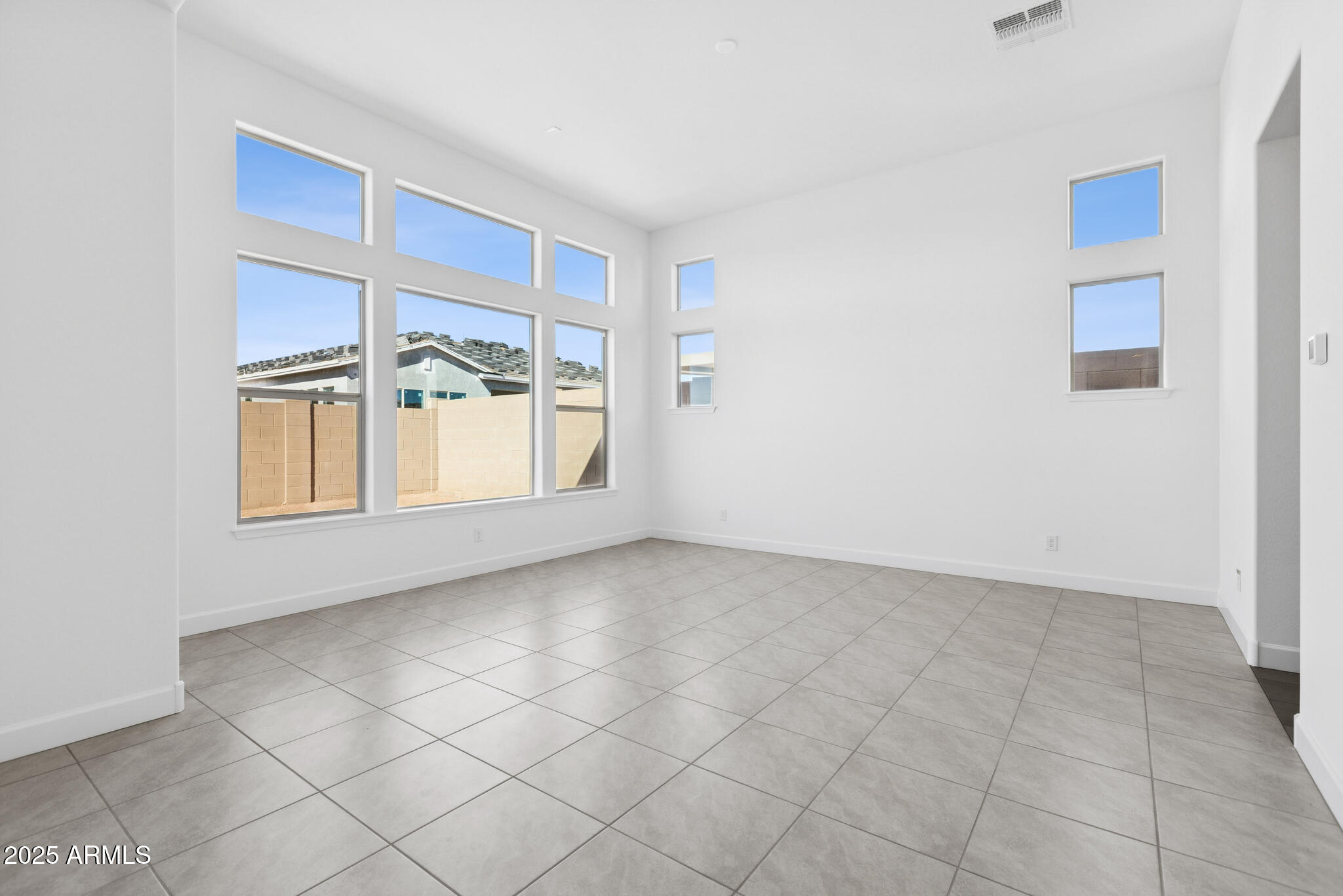 1110 West J. Waltz Way Apache Junction, AZ 85120 - Photo 9 of 32 a view of an empty room with a window