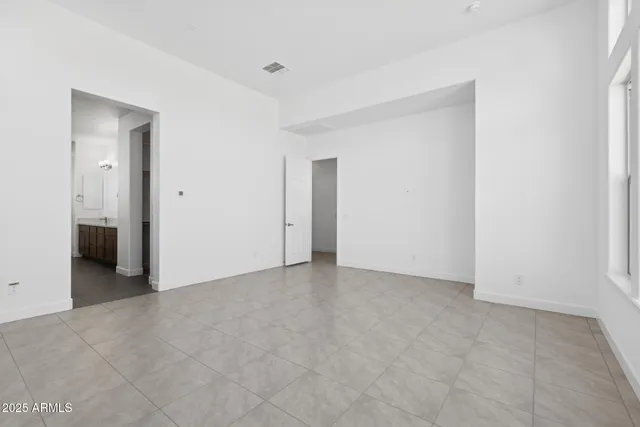 a view of an empty room and closet area