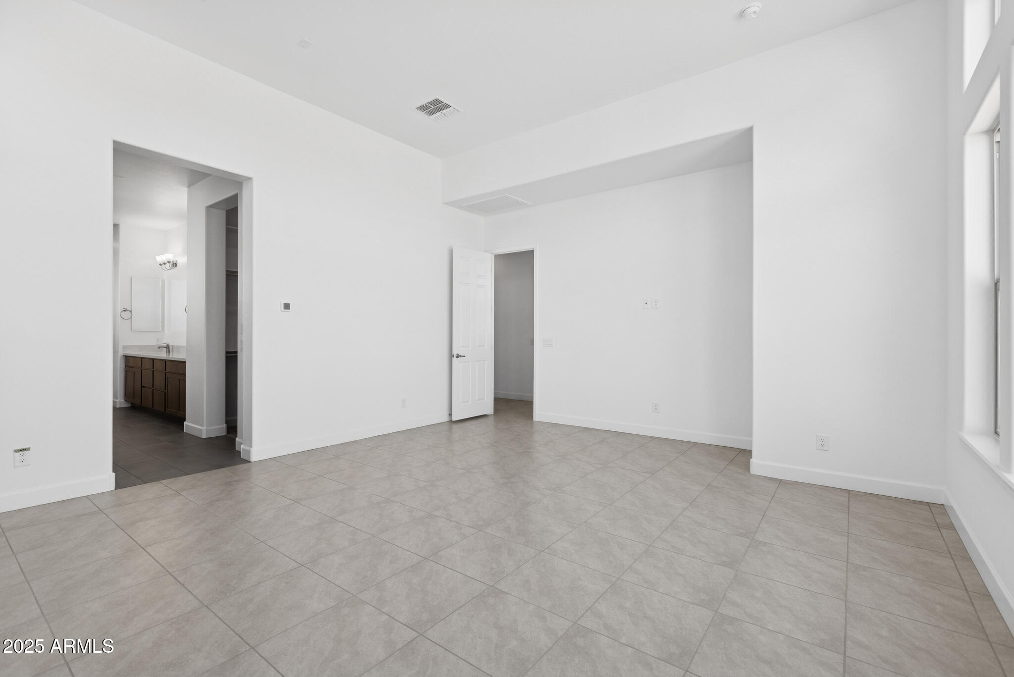 1110 West J. Waltz Way Apache Junction, AZ 85120 - Photo 10 of 32 a view of an empty room and closet area