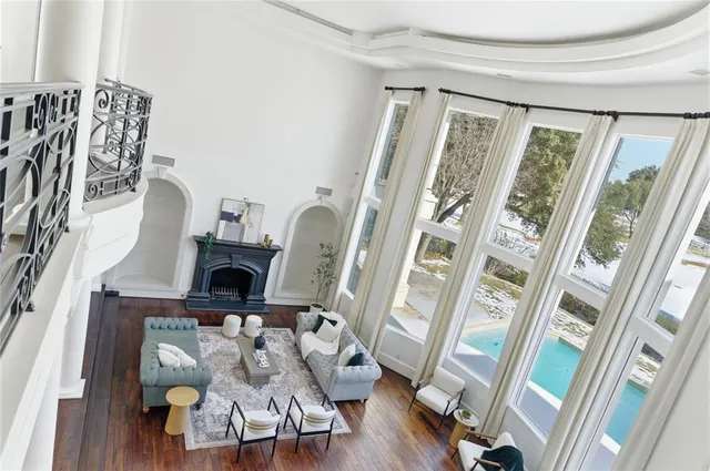 a view of living room with furniture and wooden floor