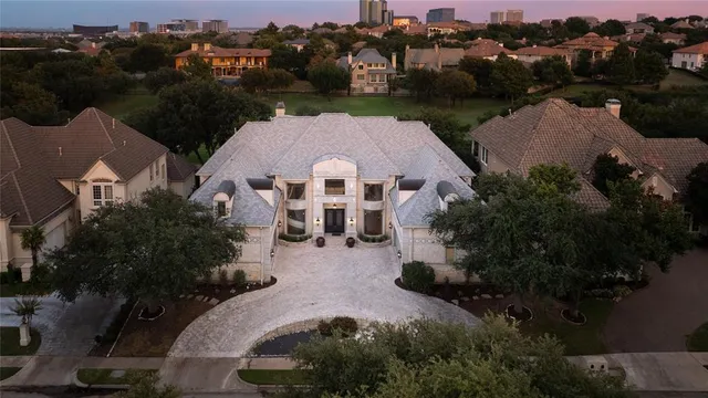 an aerial view of house with yard and lake view