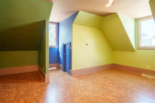 a bedroom with a bed and couch