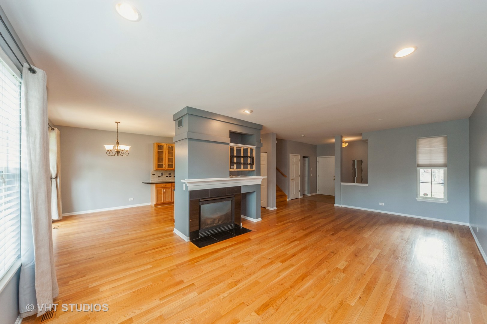 360 Bay Tree Circle Vernon Hills, IL 60061 - Photo 4 of 18 a view of empty room with wooden floor and fireplace