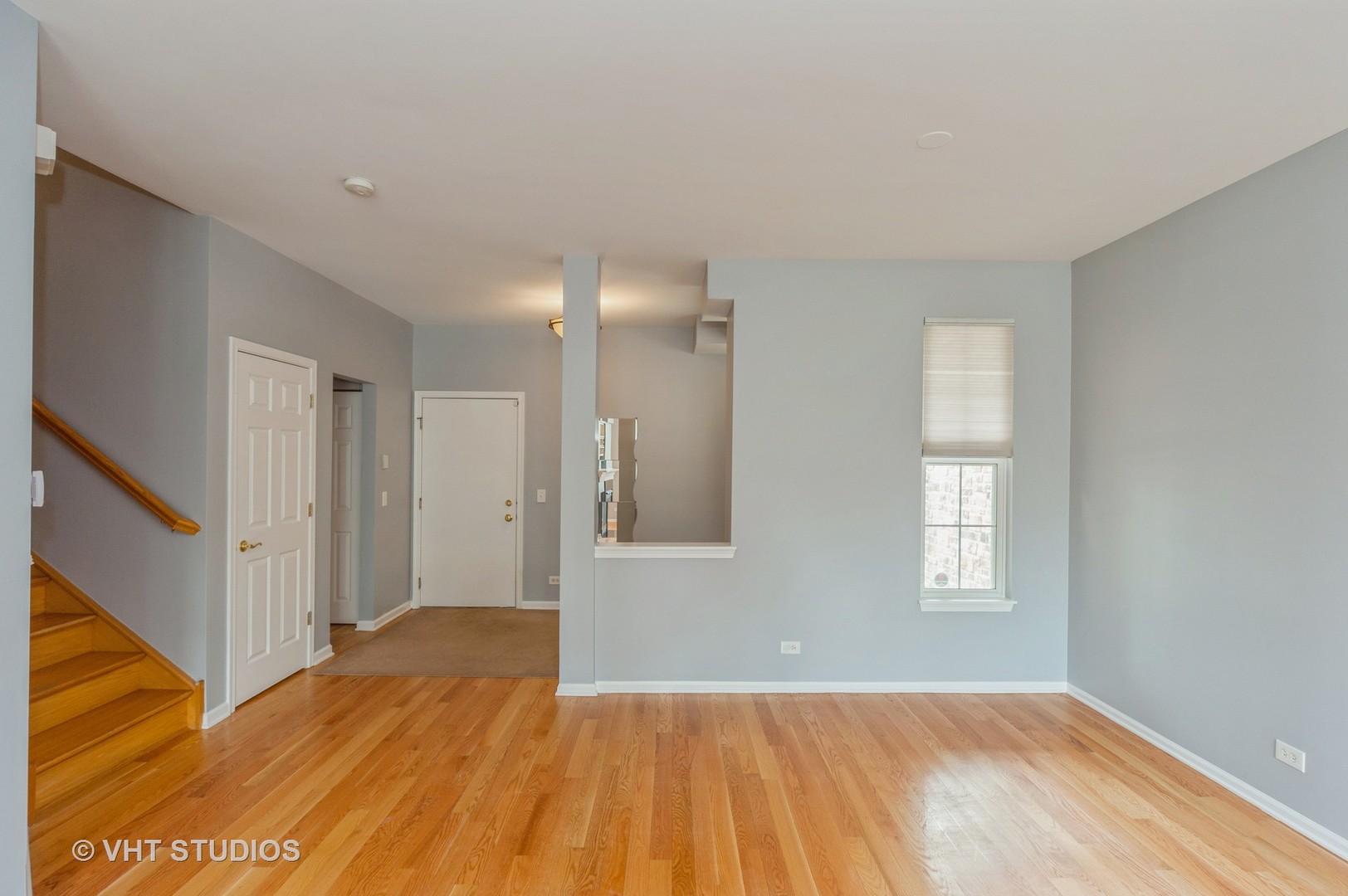 360 Bay Tree Circle Vernon Hills, IL 60061 - Photo 6 of 18 a view of an empty room with wooden floor and a window