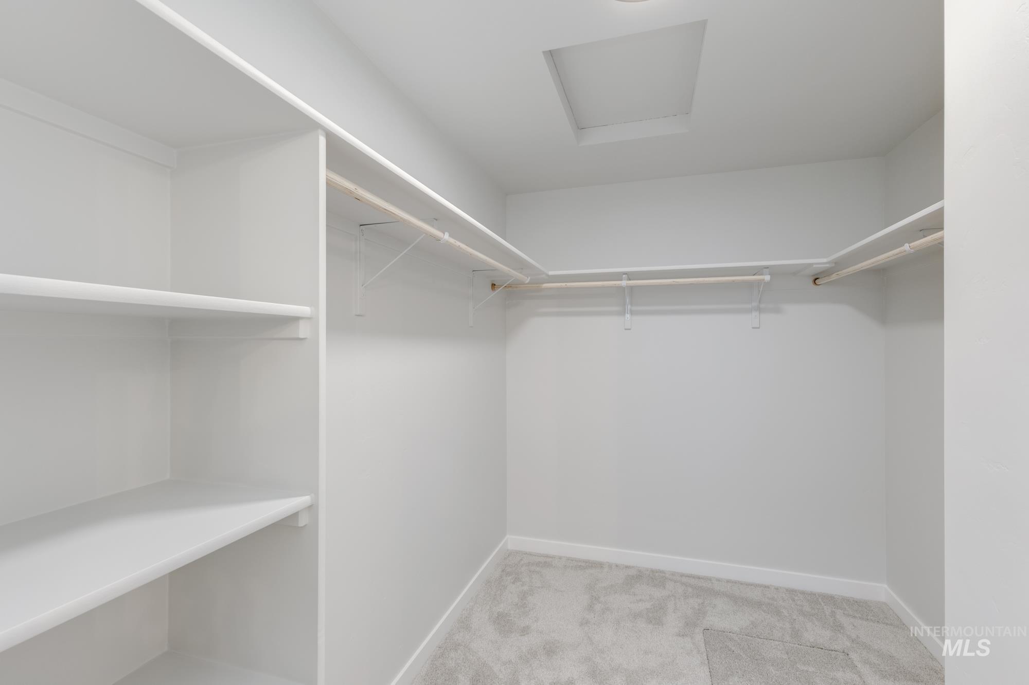 16697 Carlin Avenue Caldwell, ID 83607 - Photo 18 of 18 Spacious closet featuring attic access and light colored carpet