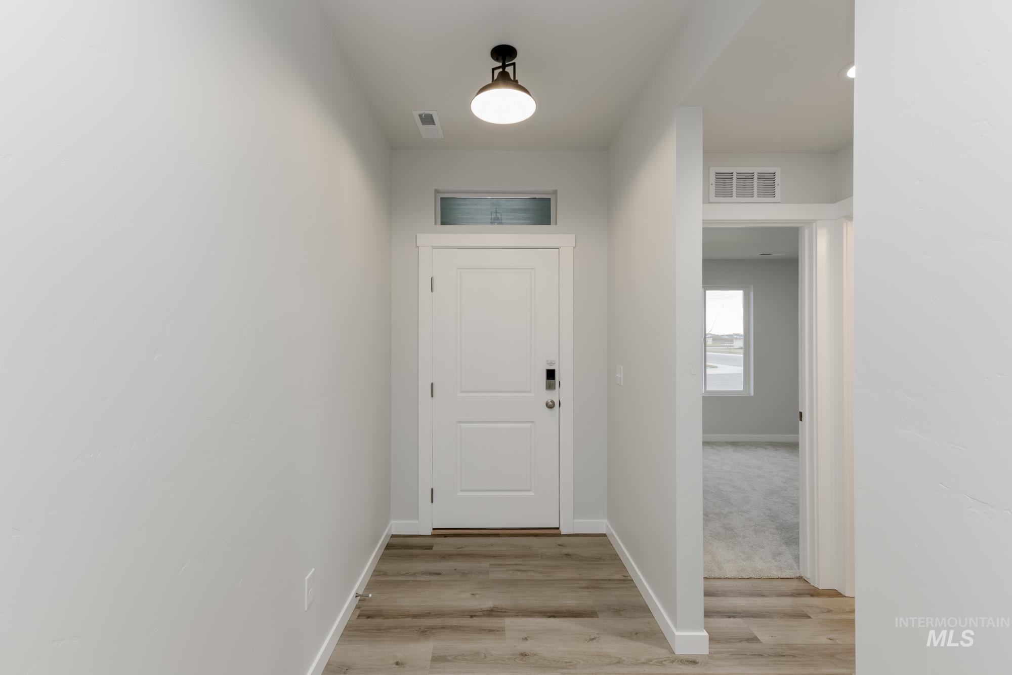 16697 Carlin Avenue Caldwell, ID 83607 - Photo 2 of 18 Doorway with wood finished floors and baseboards