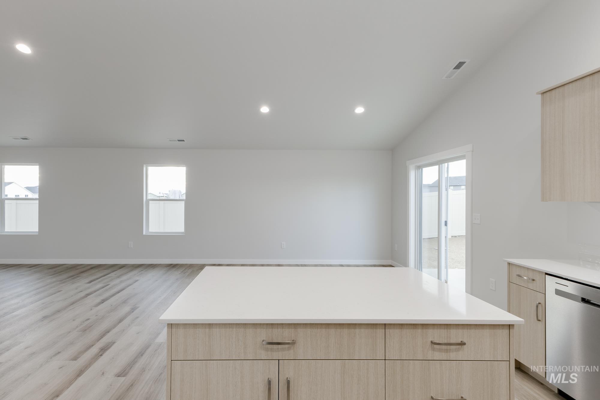 16697 Carlin Avenue Caldwell, ID 83607 - Photo 5 of 18 Kitchen featuring light brown cabinets, dishwasher, recessed lighting, a kitchen island, and light wood-style floors