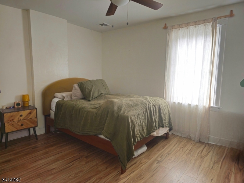 149 Broad Street Summit, NJ 07901 - Photo 3 of 12 a bedroom with a bed and window
