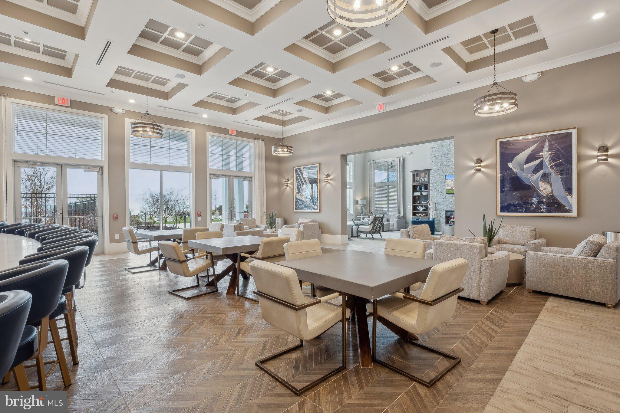 170 Harrier Way, Unit 34 Chester, MD 21619 - Photo 45 of 81 a view of a dining room with furniture large windows and wooden floor