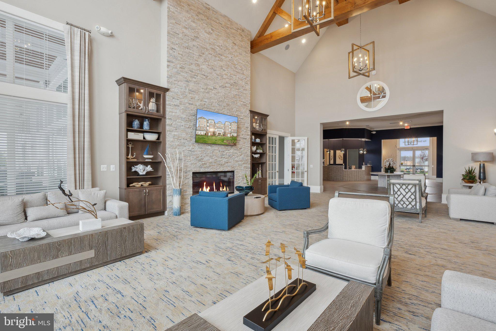 170 Harrier Way, Unit 34 Chester, MD 21619 - Photo 47 of 81 a living room with furniture and a fireplace