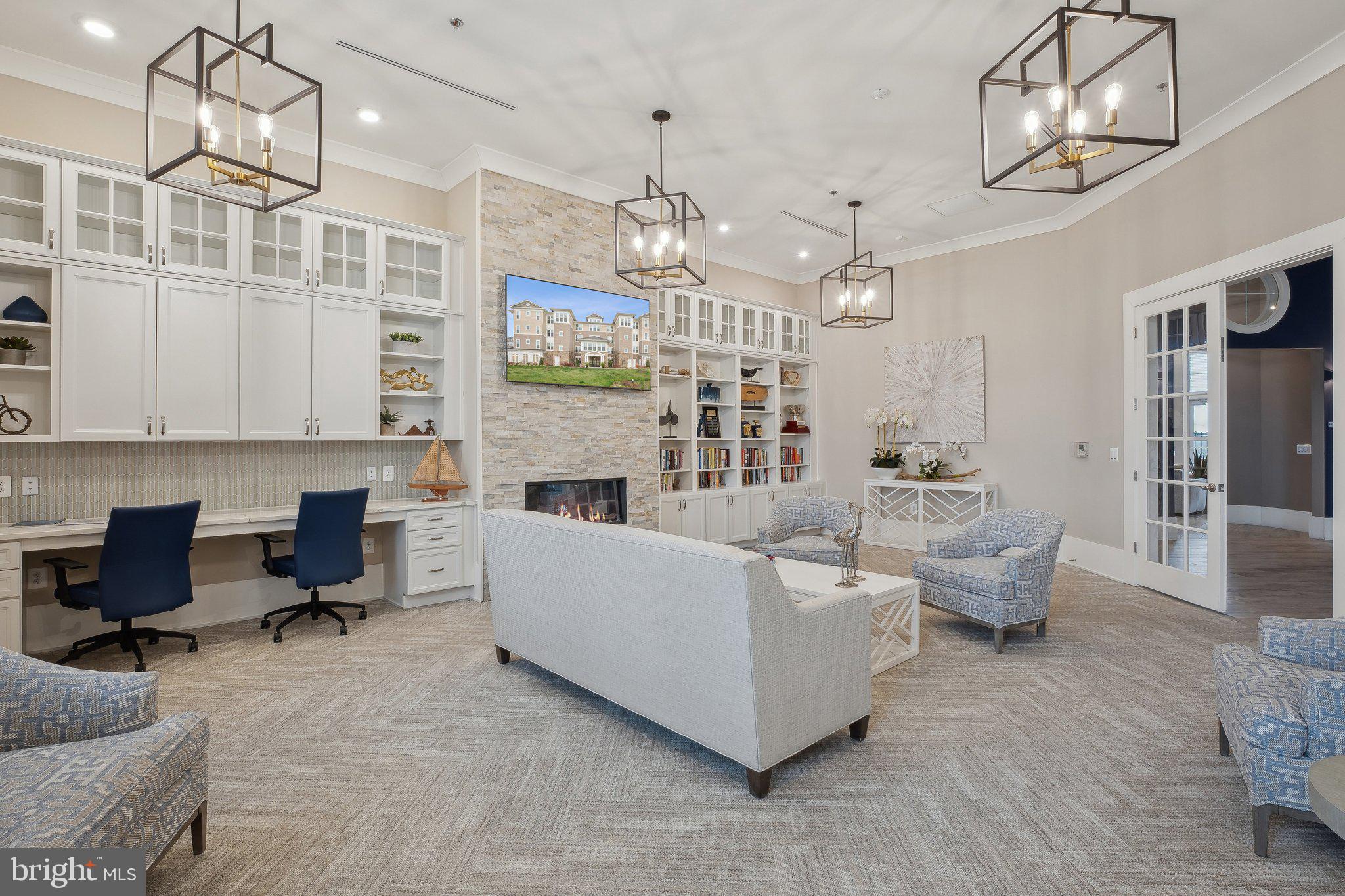 170 Harrier Way, Unit 34 Chester, MD 21619 - Photo 48 of 81 a living room with furniture and a chandelier