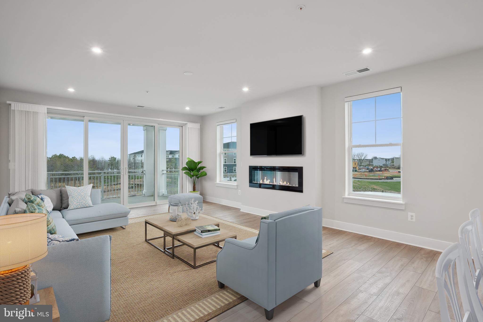 170 Harrier Way, Unit 34 Chester, MD 21619 - Photo 7 of 81 a living room with furniture and a flat screen tv