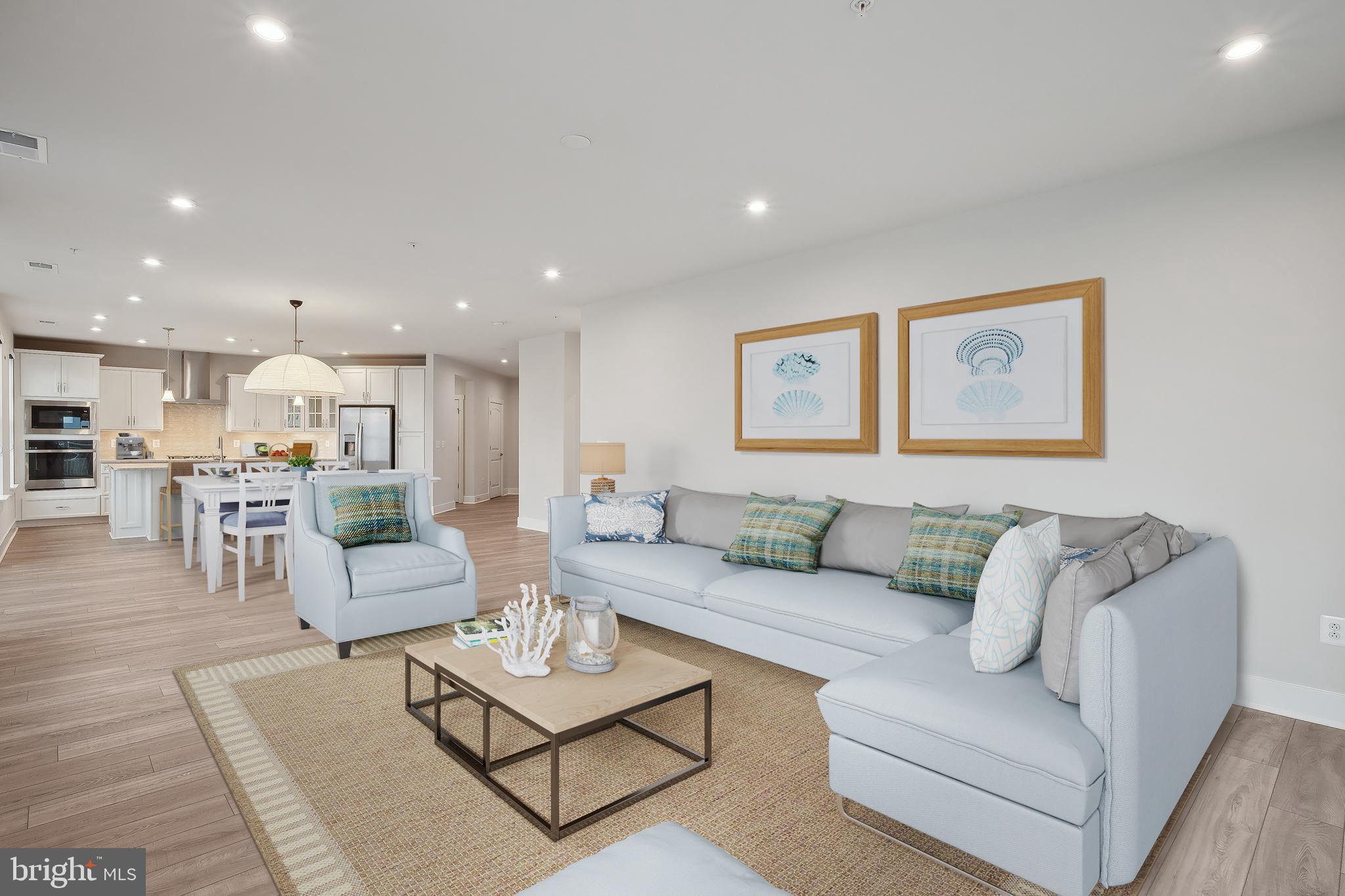 170 Harrier Way, Unit 34 Chester, MD 21619 - Photo 9 of 81 a living room with furniture and view of kitchen