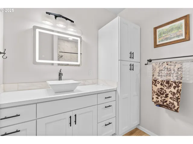 a bathroom with a sink and a mirror