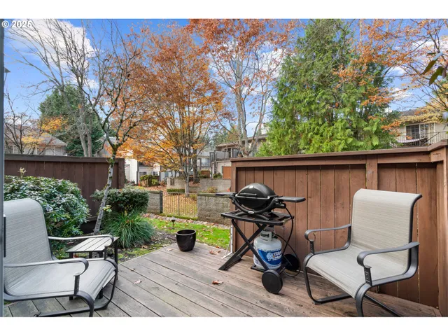 a view of chair and table in the backyard