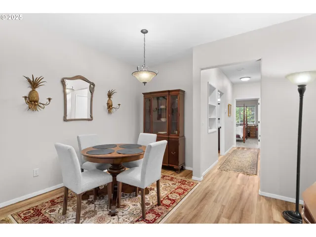 a dining room with furniture and window