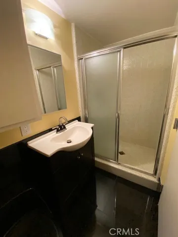a bathroom with a sink and mirror