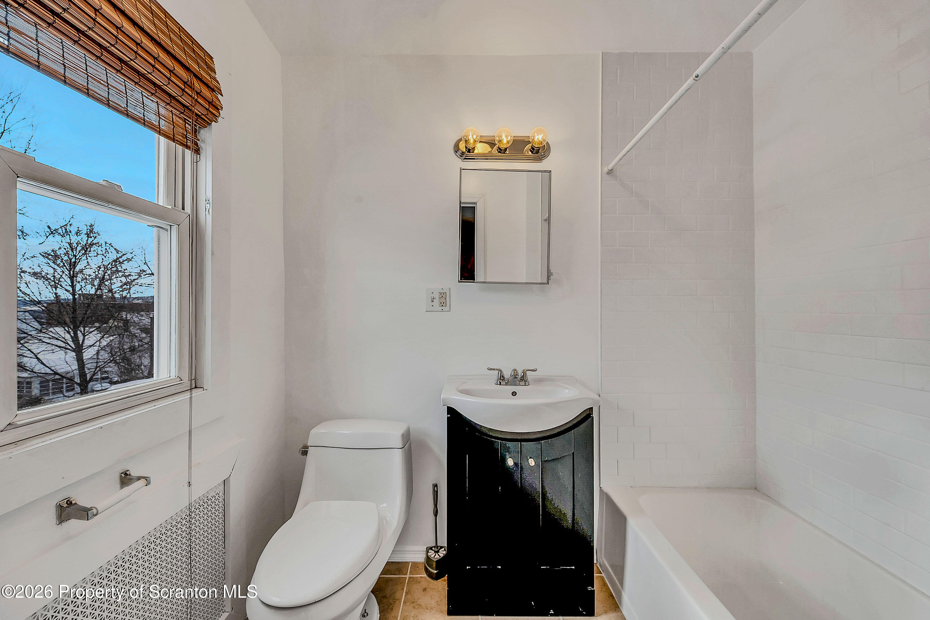 208 East Warren Street, Unit 1 Dunmore, PA 18512 - Photo 15 of 18 a bathroom with a toilet and a sink