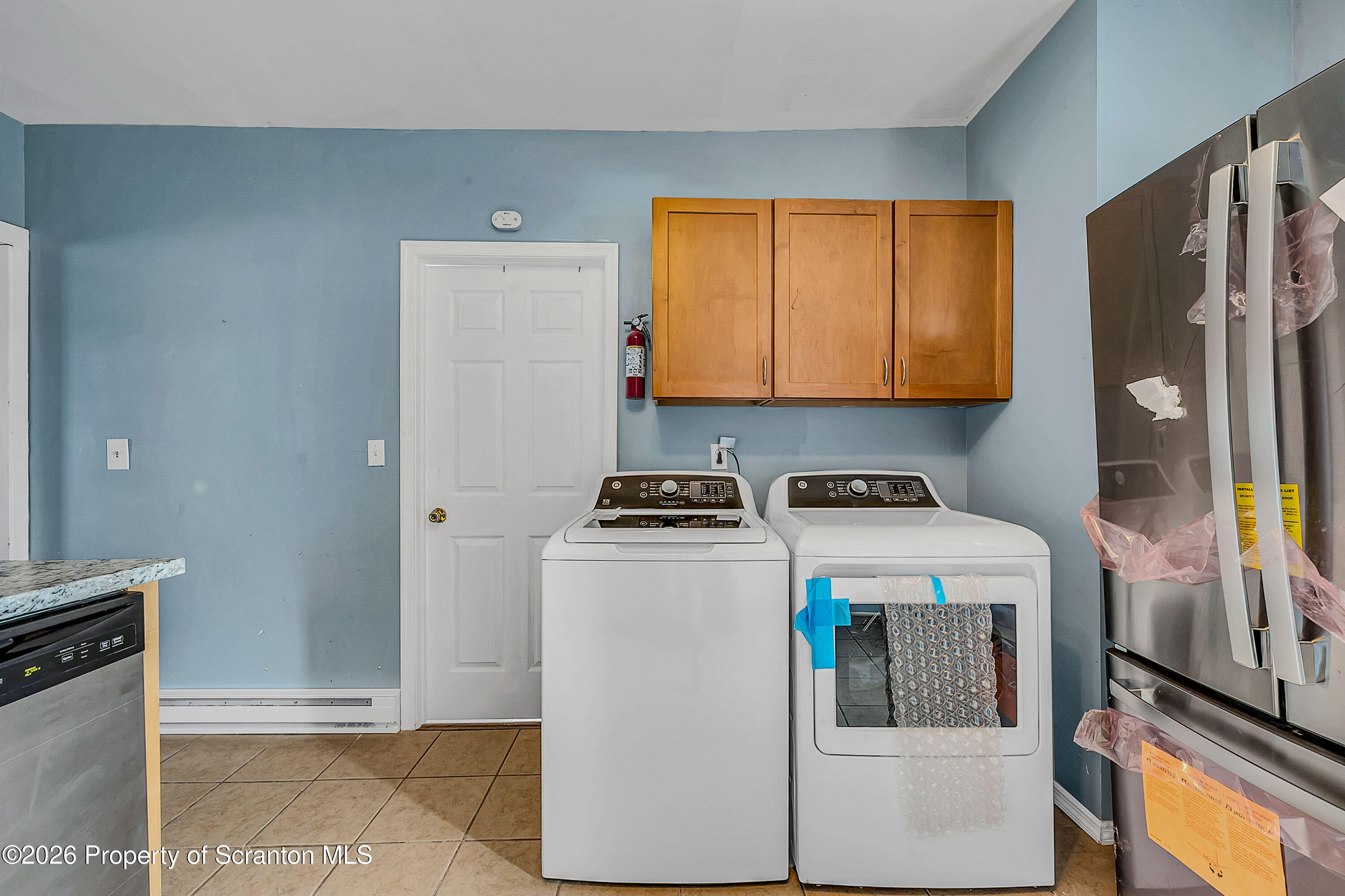 208 East Warren Street, Unit 1 Dunmore, PA 18512 - Photo 17 of 18 a utility room with dryer and washer