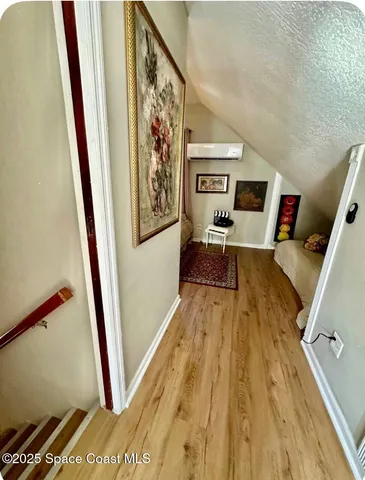 a view of an entryway with wooden floor