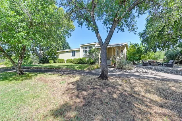 an empty room with windows and mountain view