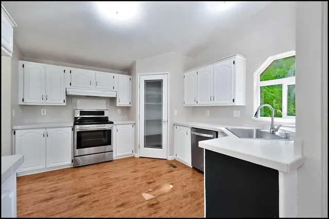 a view of a big yard with an trees