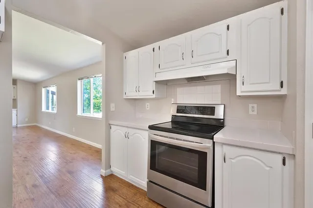 a view of a lake with houses in the back