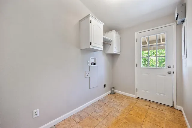 a view of a lush green hillside and houses