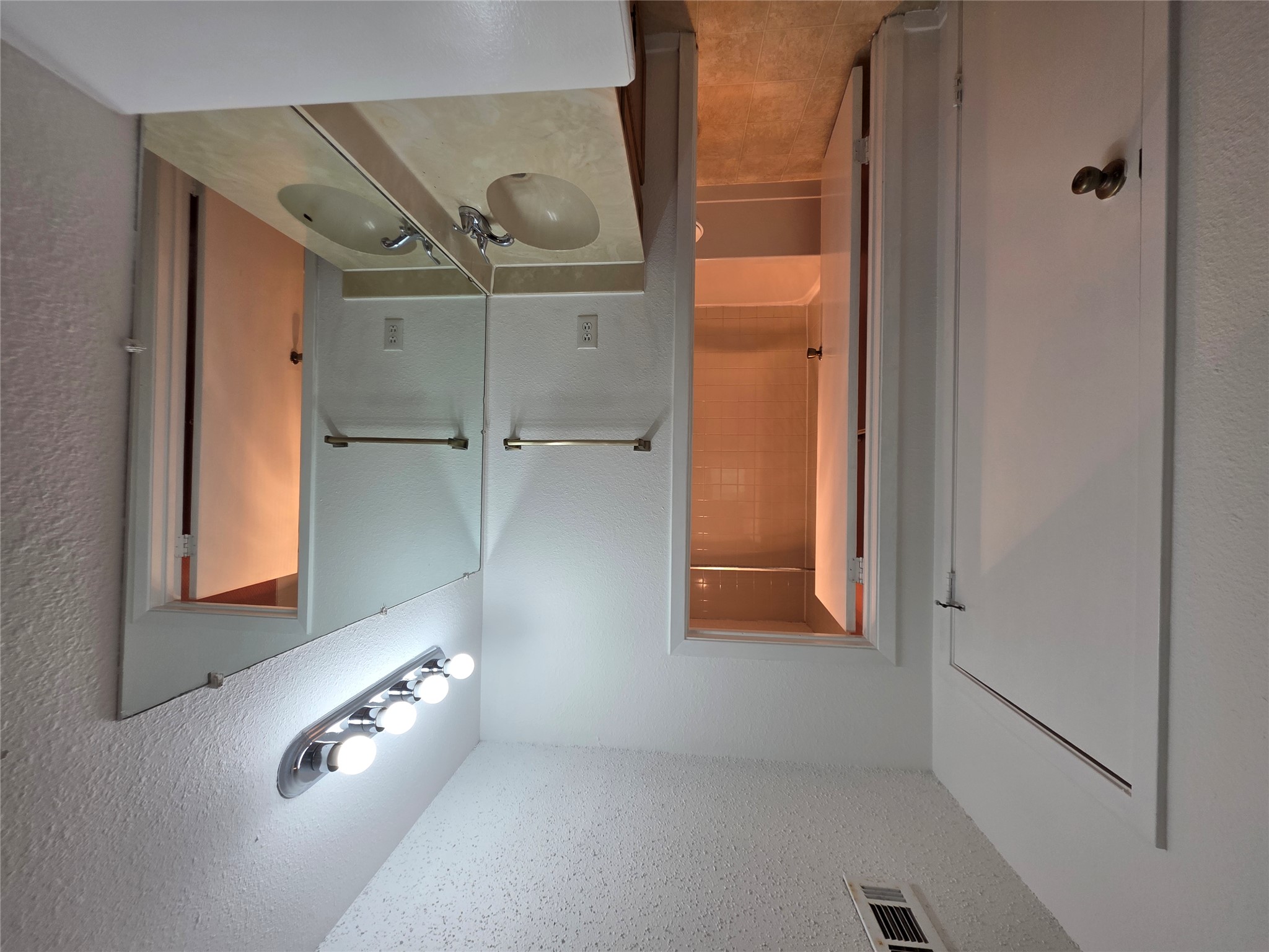 8818 Clearbrook Trail Austin, TX 78729 - Photo 17 of 22 Unit A Primary Bathroom. Walk-in Closet is behind closed door on left