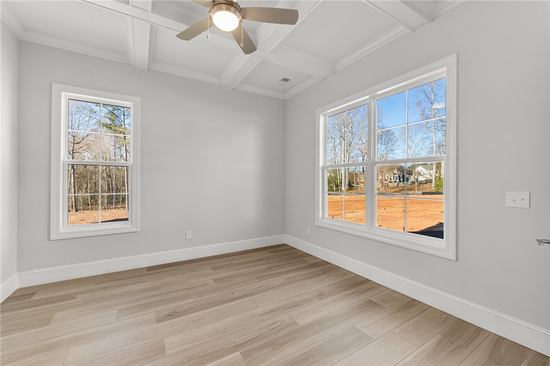 141 Rickys Path Easley, SC 29642 - Photo 24 of 40 This spacious room features ample natural light, pristine flooring, and a decorative ceiling.