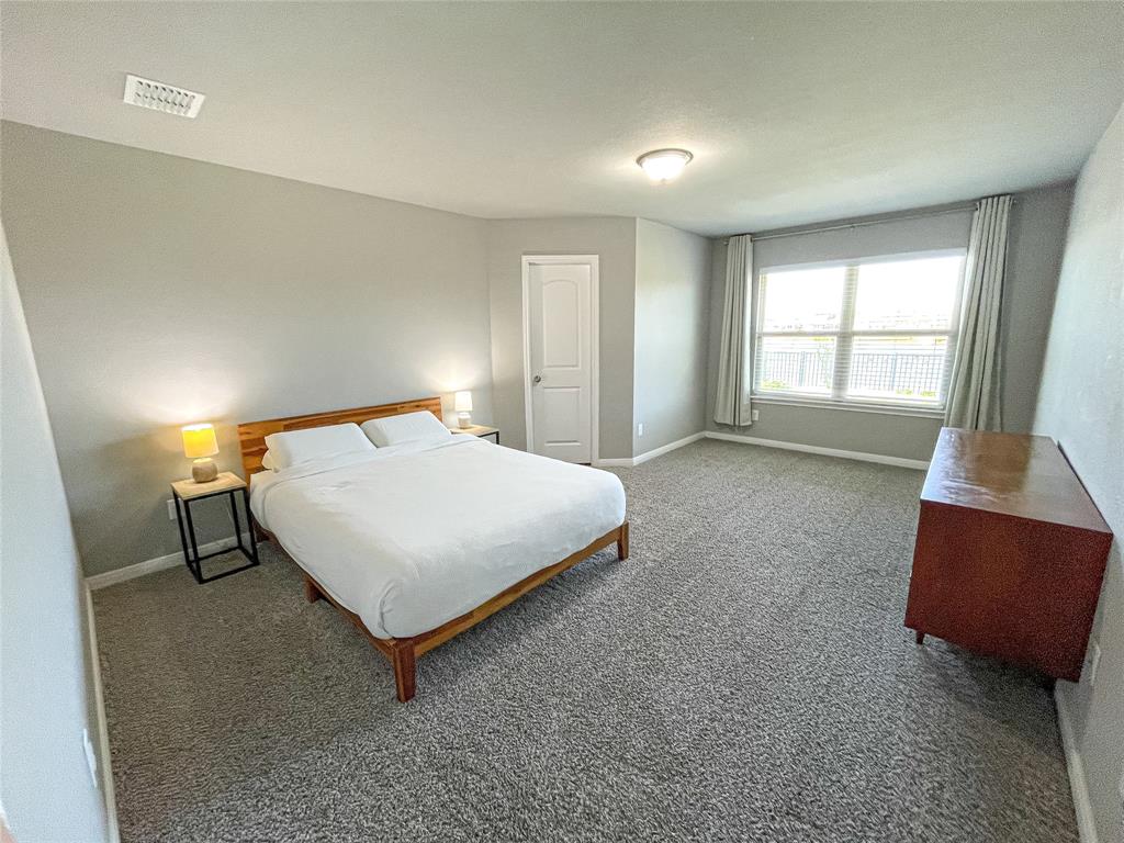 3920 South Fork Ranch Road Waco, TX 76705 - Photo 12 of 21 a bedroom with a bed and window