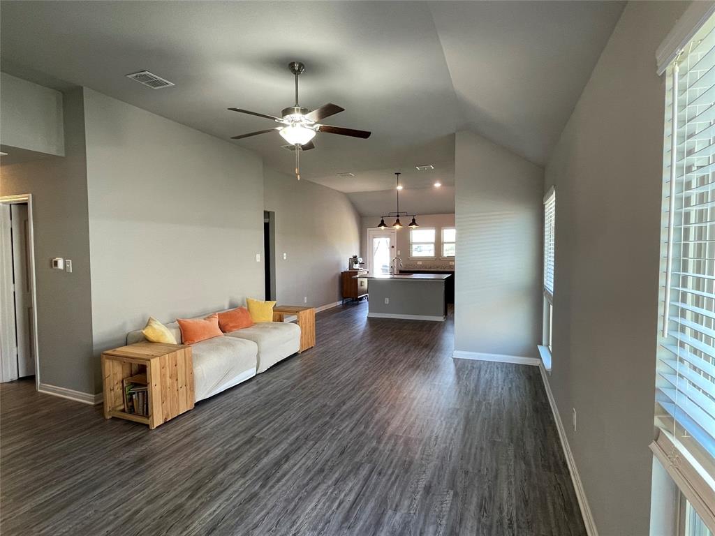 3920 South Fork Ranch Road Waco, TX 76705 - Photo 2 of 21 a living room with furniture and wooden floor