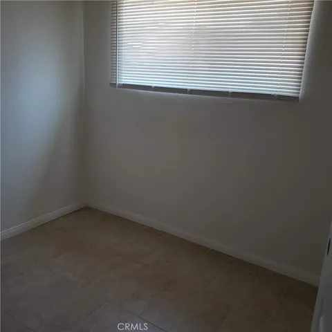 a view of a room that has a window in it
