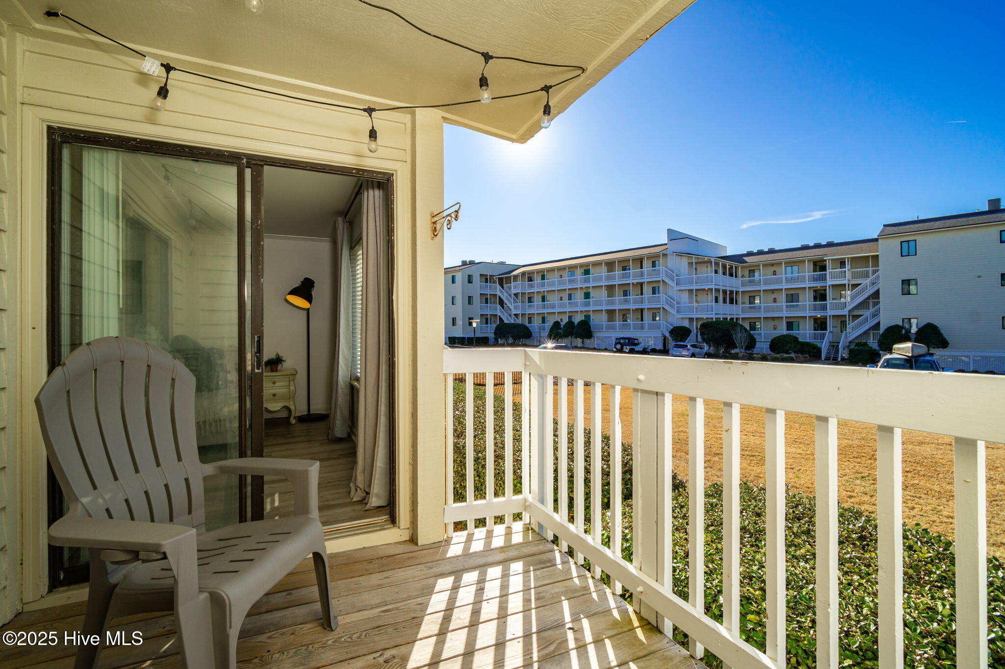 10300 Coast Guard Road, Unit C103 POINT EMERALD VILLAS Emerald Isle, NC 28594 - Photo 12 of 44 Covered porch off primary suite