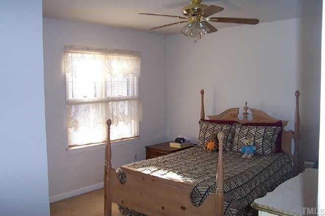 6151 Bushmills Street Raleigh, NC 27613 - Photo 7 of 10 a room with a table and window