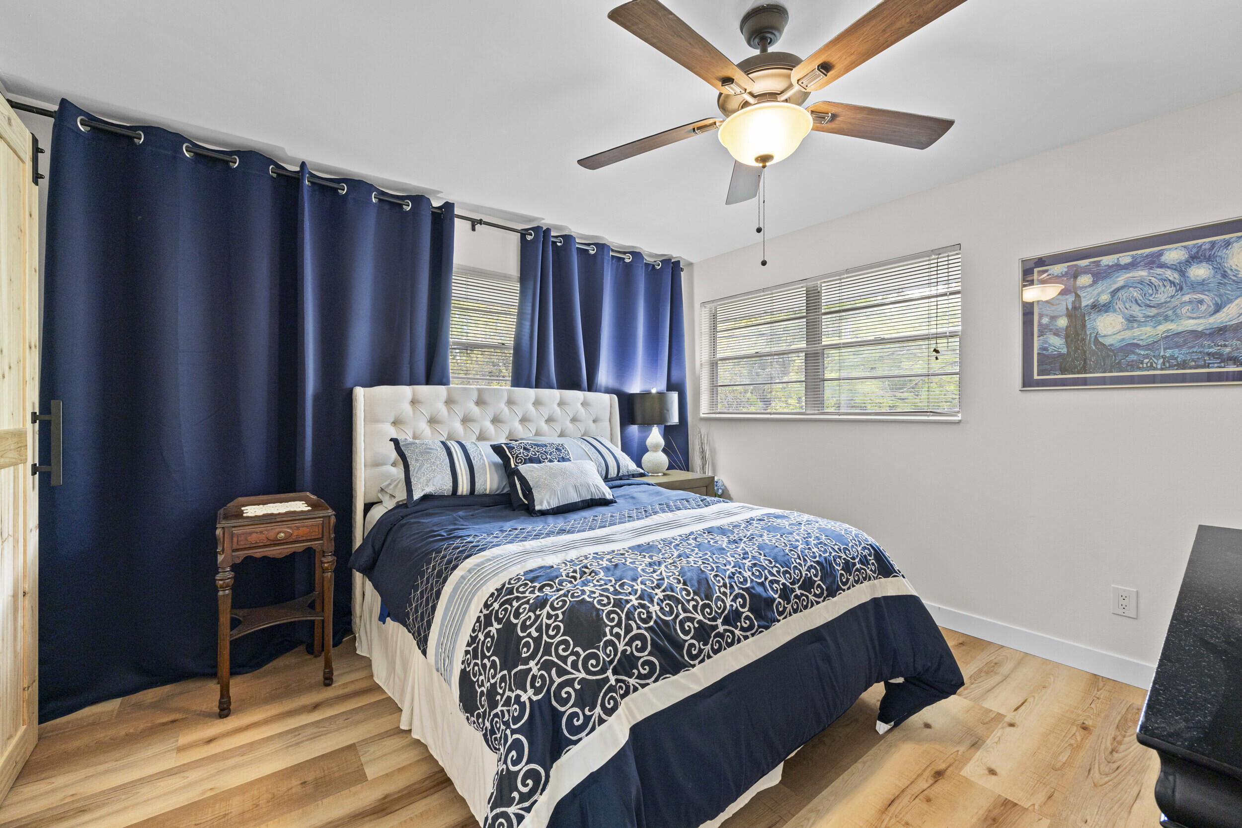 2929 Southeast Ocean Boulevard, Unit 10510 Stuart, FL 34996 - Photo 16 of 37 a bedroom with a bed and a window